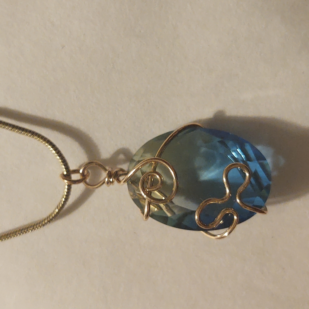 Aquamarine stone hand wired setting with gold chain